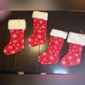 Red Christmas Stockings with littering White Snowflakes used for one season.